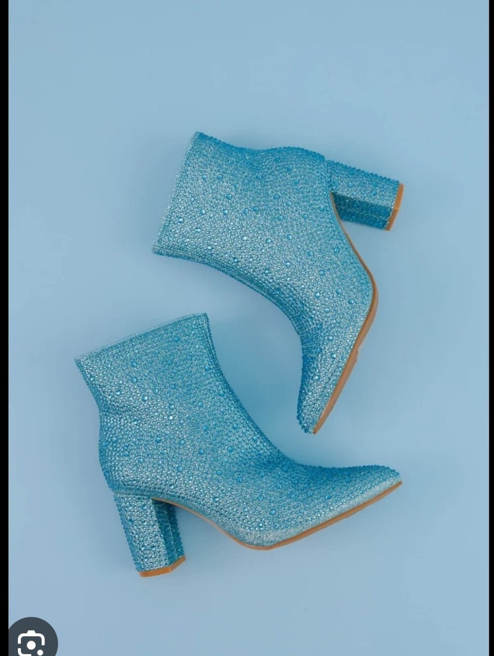 blue rhinestone ankle booties feature a pointed toe and a chunky block heel.